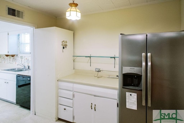 kitchen with a sink, visible vents, white cabinets, black dishwasher, and stainless steel refrigerator with ice dispenser