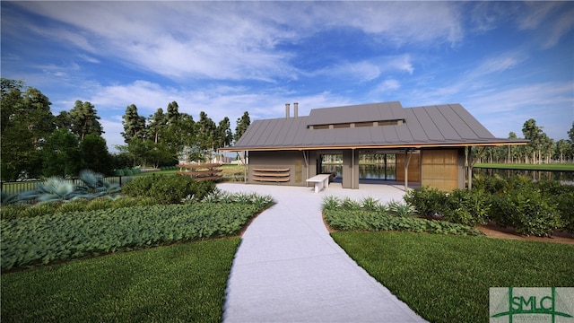 view of front of house featuring a standing seam roof and metal roof