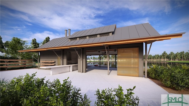 view of community featuring a patio area and a water view