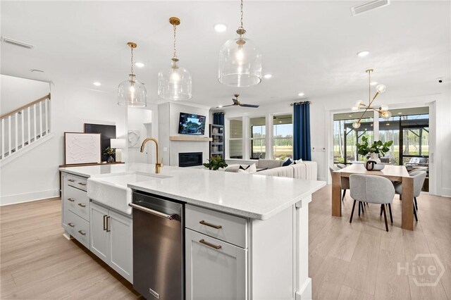 323 Birch Dr, Richmond Hill, GA 31324 - kitchen featuring dishwasher, a sink, open floor plan, recessed lighting, and plenty of natural light