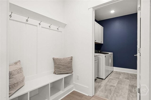 323 Birch Dr, Richmond Hill, GA 31324 - laundry room featuring cabinet space, separate washer and dryer, and baseboards