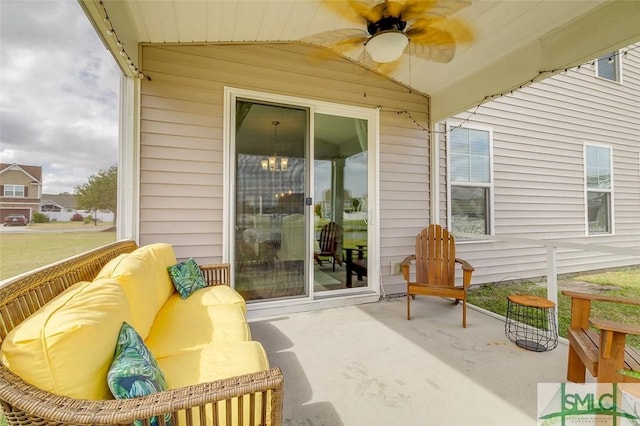 sunroom / solarium featuring a ceiling fan and lofted ceiling