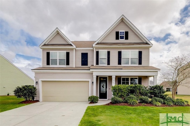 view of front of home featuring an attached garage, concrete driveway, and a front yard