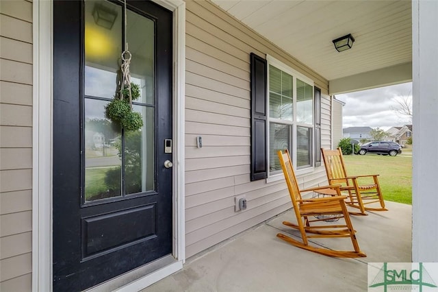 doorway to property featuring covered porch