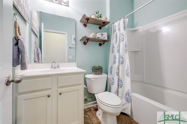 bathroom with shower / bath combo with shower curtain, vanity, and toilet