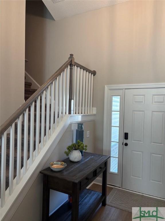 119 Sams Dr, Guyton, GA 31312 - entryway with wood finished floors and stairs