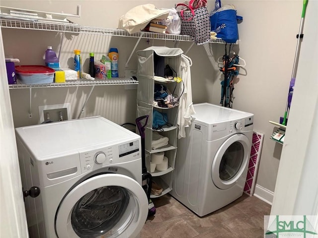 119 Sams Dr, Guyton, GA 31312 - laundry room with washing machine and dryer and baseboards