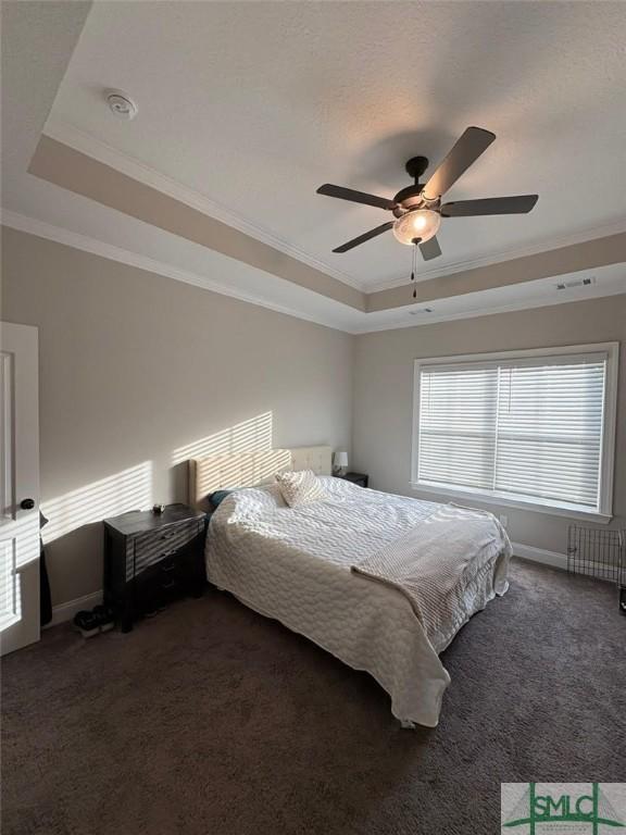 119 Sams Dr, Guyton, GA 31312 - bedroom featuring a raised ceiling, ornamental molding, dark carpet, baseboards, and ceiling fan