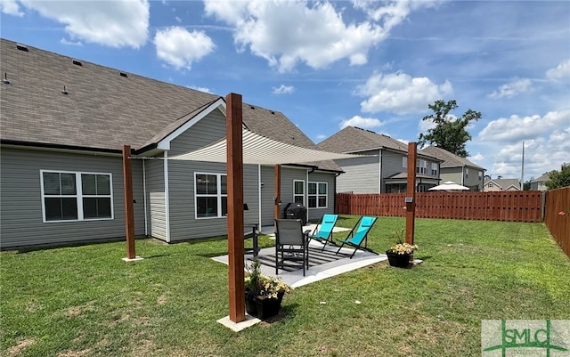 119 Sams Dr, Guyton, GA 31312 - rear view of house with a patio area and a shingled roof
