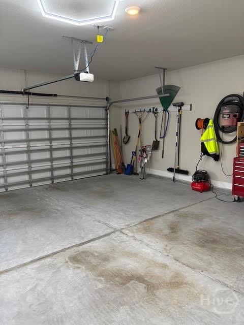 119 Sams Dr, Guyton, GA 31312 - garage featuring a garage door opener