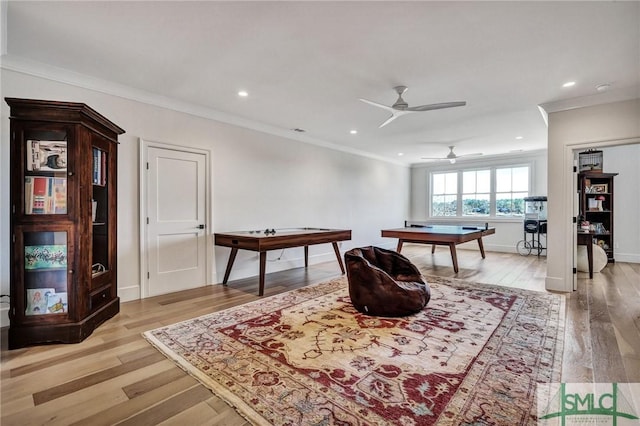 playroom with baseboards, recessed lighting, light wood-style flooring, and crown molding