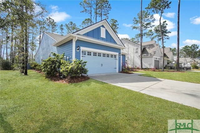 view of front of property with an attached garage, driveway, board and batten siding, and a front yard