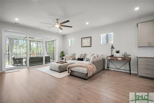 bedroom with light wood-type flooring, access to exterior, and multiple windows