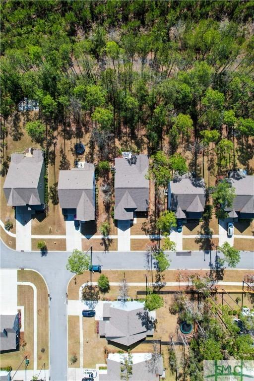 birds eye view of property with a residential view