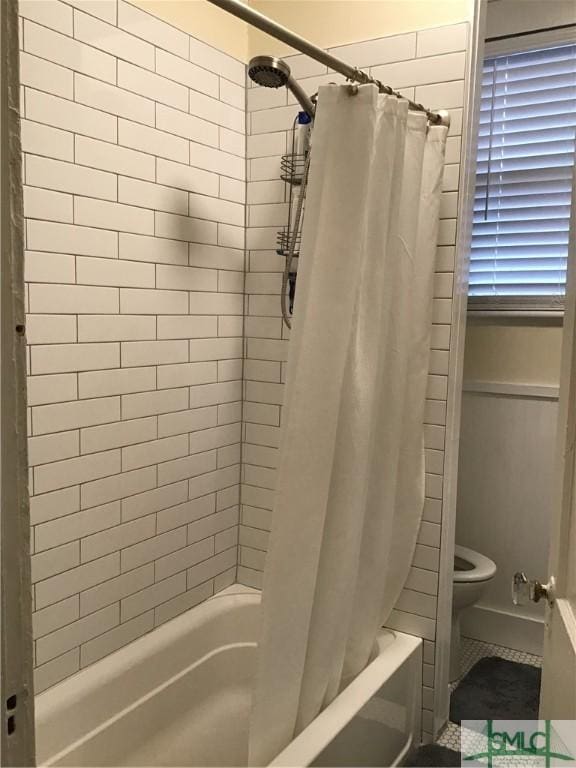 full bathroom featuring shower / tub combo and toilet