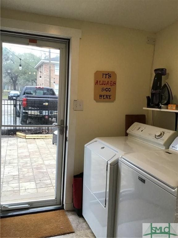 clothes washing area featuring laundry area and separate washer and dryer