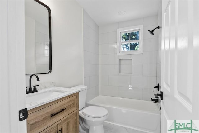 bathroom featuring shower / washtub combination, vanity, and toilet