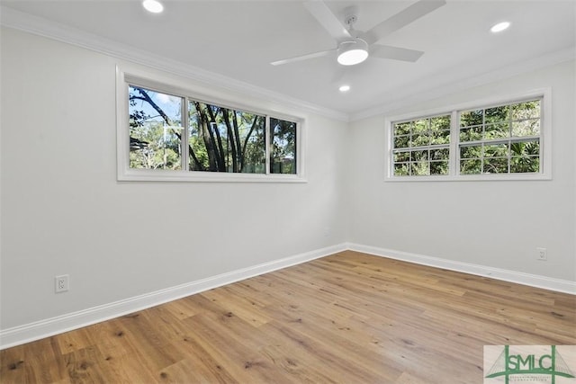 spare room with baseboards, ornamental molding, and recessed lighting