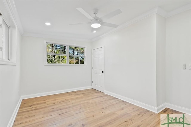 spare room featuring recessed lighting, light wood-style flooring, ornamental molding, a ceiling fan, and baseboards