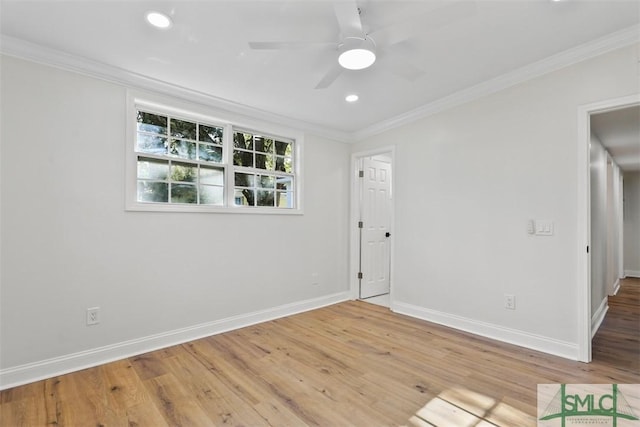 empty room featuring crown molding, recessed lighting, ceiling fan, wood finished floors, and baseboards