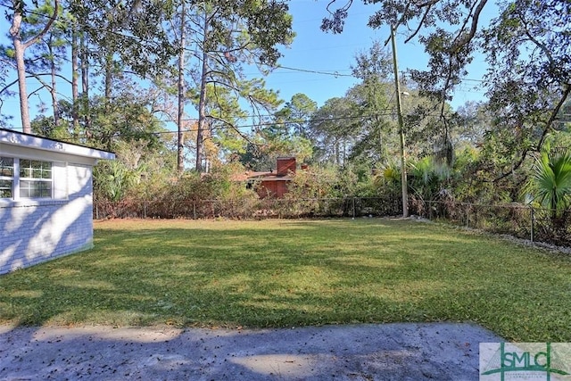 view of yard with fence