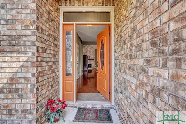 entrance to property with brick siding