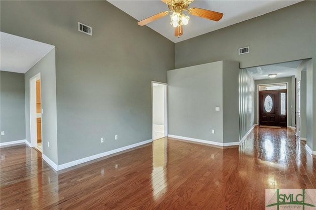 interior space featuring visible vents, baseboards, and wood finished floors