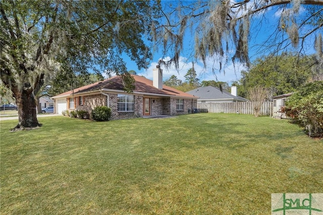 exterior space with fence and an attached garage