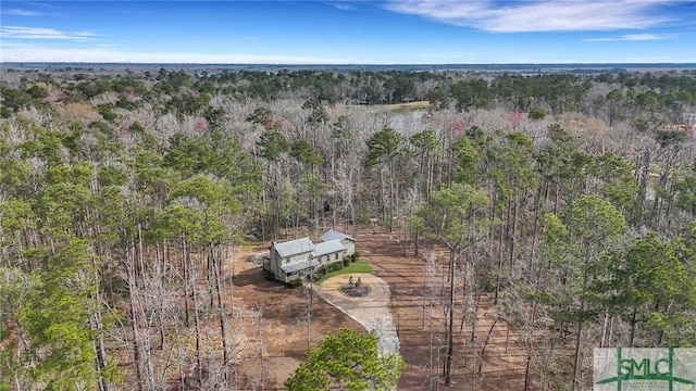 aerial view featuring a view of trees