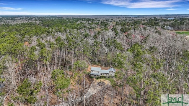 aerial view featuring a wooded view