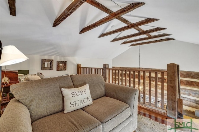 living room with lofted ceiling with beams and wood finished floors