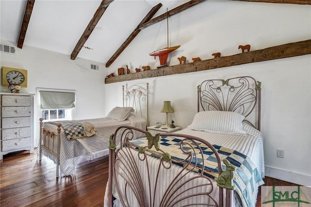 bedroom with beam ceiling, visible vents, and wood finished floors