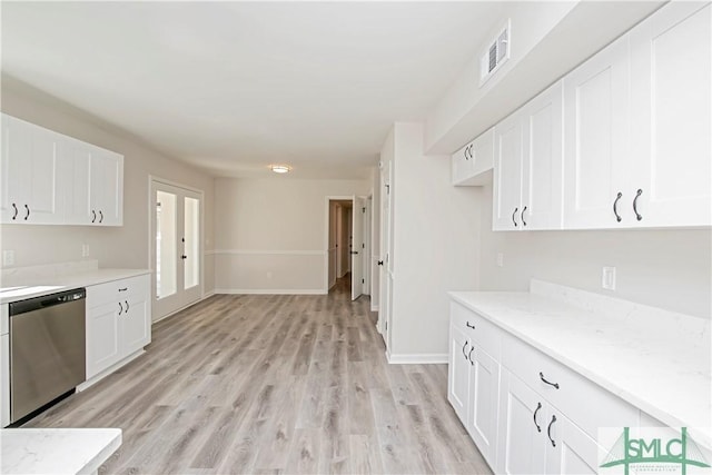 kitchen with light wood-style floors, visible vents, white cabinetry, and stainless steel dishwasher