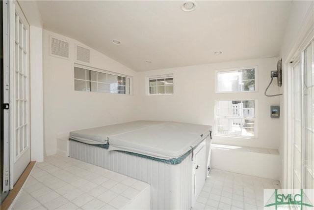 bedroom featuring light tile patterned floors, visible vents, vaulted ceiling, and recessed lighting