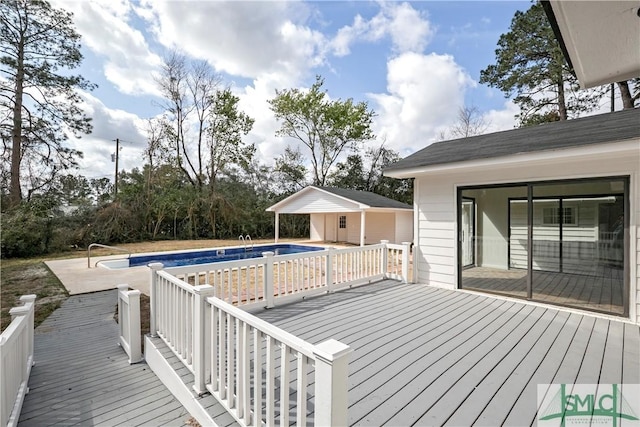 deck featuring an outdoor pool