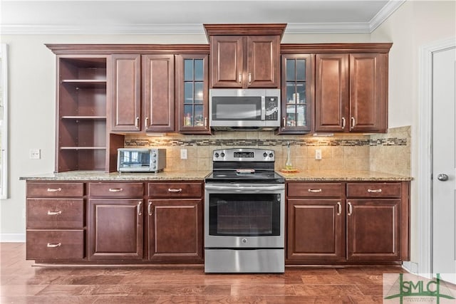 kitchen featuring a toaster, stainless steel appliances, crown molding, open shelves, and backsplash