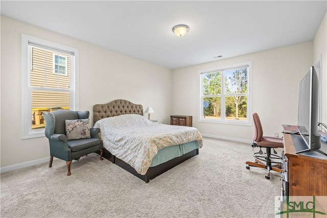 bedroom with carpet, visible vents, and baseboards