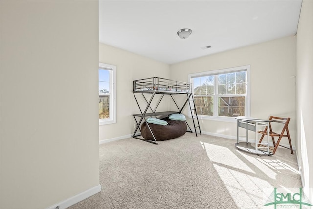 bedroom with carpet flooring, visible vents, and baseboards