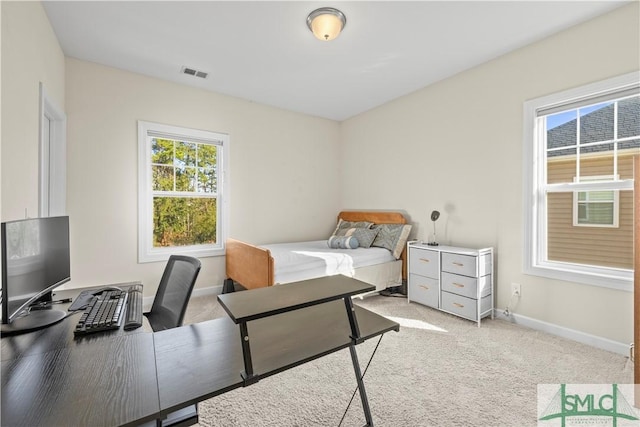 bedroom featuring light carpet, visible vents, and baseboards