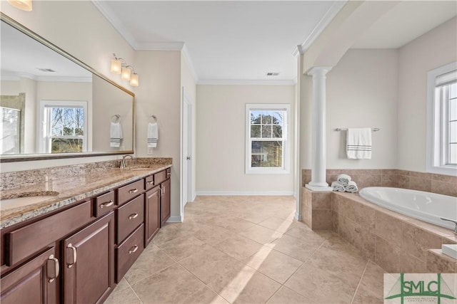 bathroom featuring ornamental molding, a sink, and ornate columns