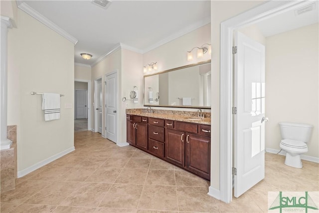 bathroom featuring double vanity, ornamental molding, a sink, and visible vents