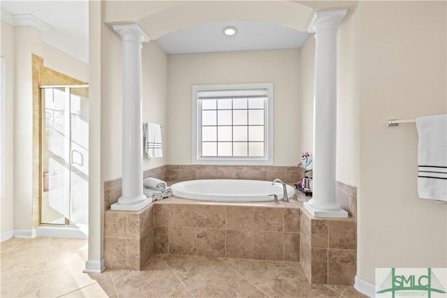 bathroom with a bath and decorative columns