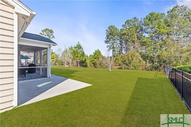 view of yard featuring a patio and fence