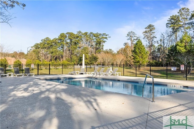 pool featuring a patio area and fence