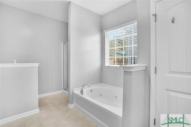 full bath with baseboards, a tub with jets, a stall shower, and tile patterned floors