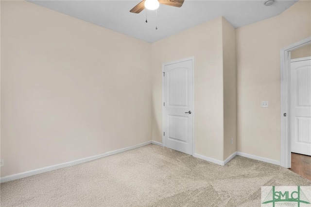 unfurnished bedroom with carpet, ceiling fan, and baseboards