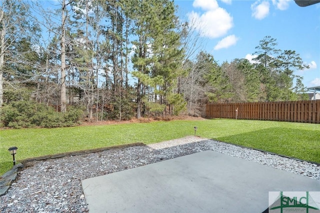 view of patio featuring fence