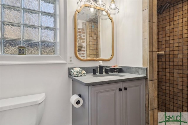 full bathroom featuring vanity and toilet