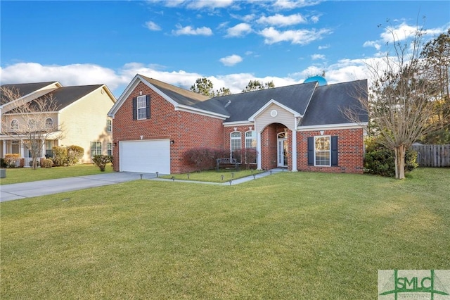 view of front of house featuring brick siding, driveway, and a front lawn