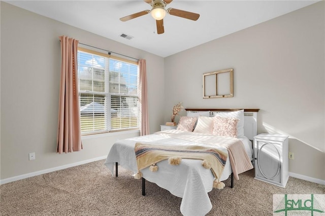 bedroom with a ceiling fan, carpet flooring, visible vents, and baseboards